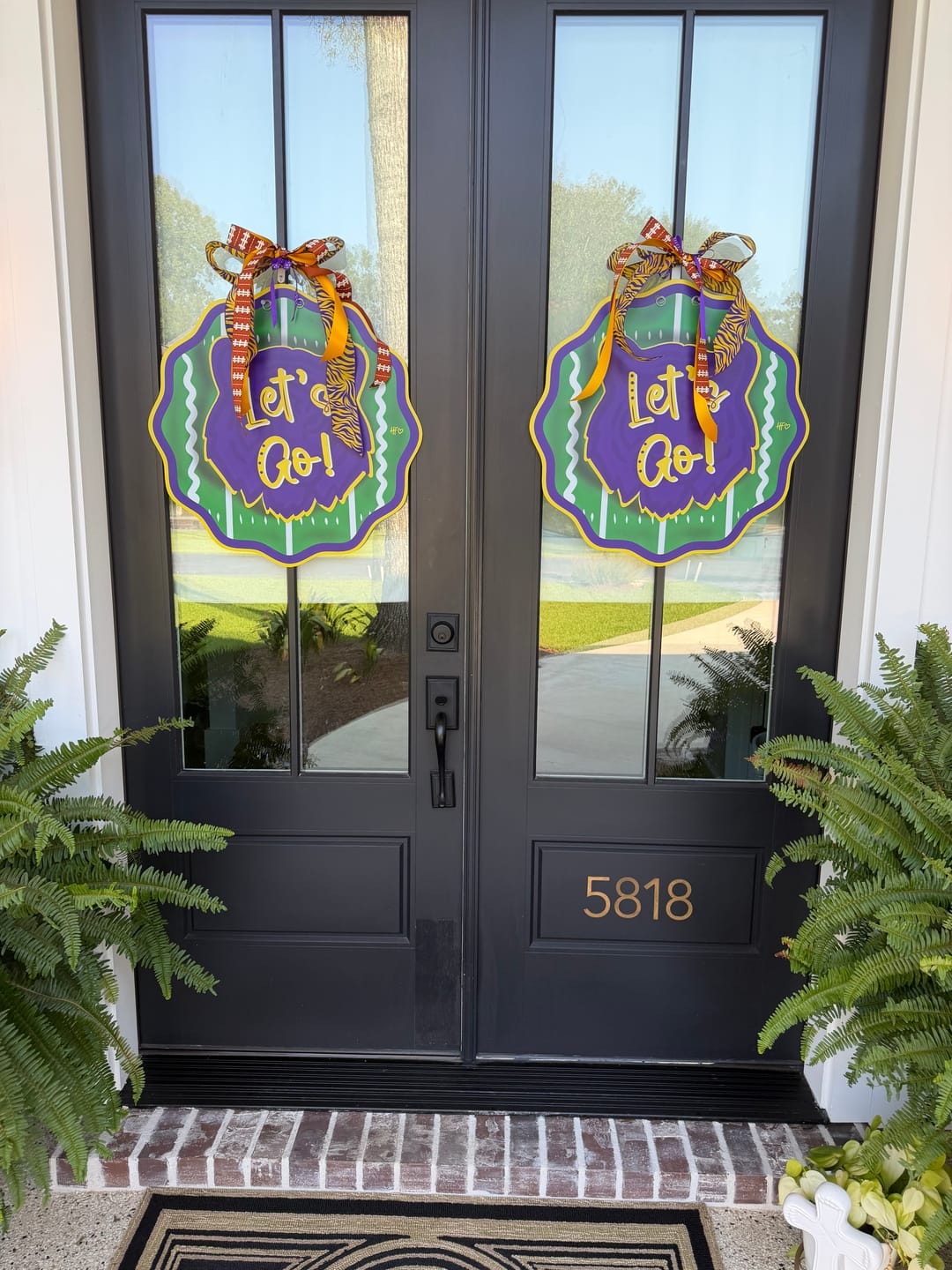 Customer photo review of Purple & Gold Let's Go Tiger Door Hanger