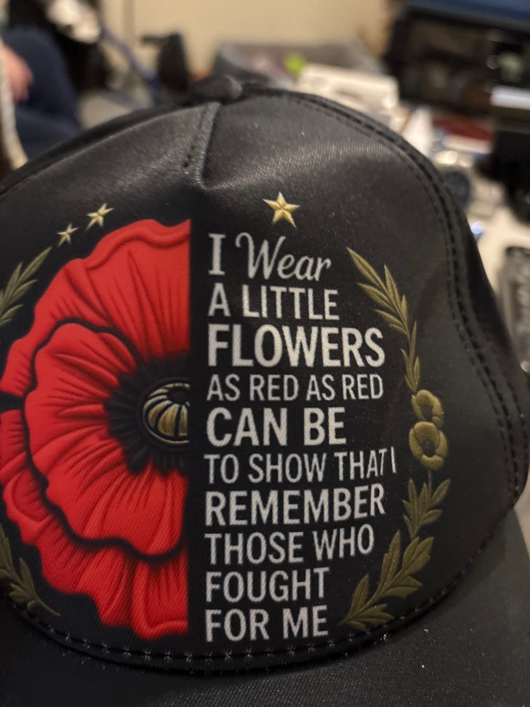 Customer photo review of 🧢"Lest We Forget" Remembrance Flowers Baseball Cap - Meaningful Patriotic Gift for Veterans & Family