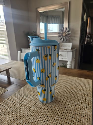 Customer's Thicc Buddy mug with a blue and white striped pattern featuring yellow lemons, on a table.