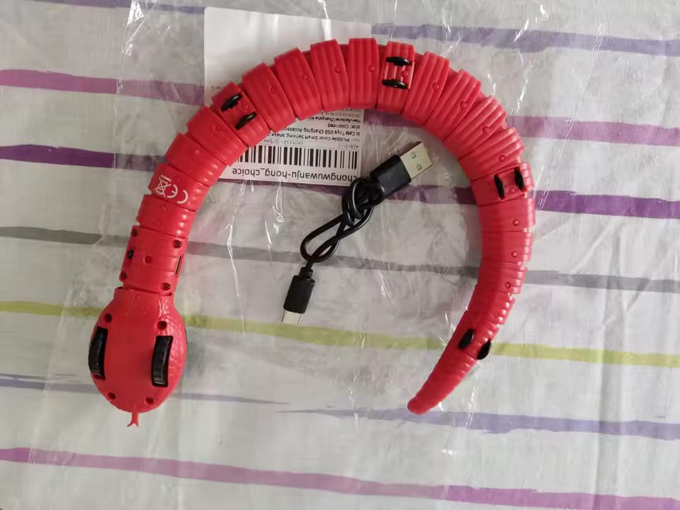 Customer photo review of The Slither — Auto Sensing Cat Snake Toy