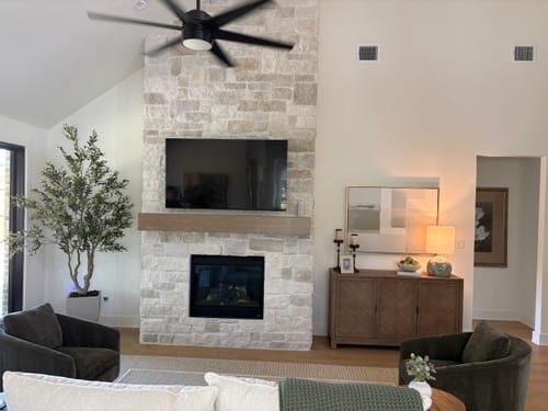 Customer's Soft Geometric Planes Canvas Art displayed above a wooden sideboard in a contemporary living room.