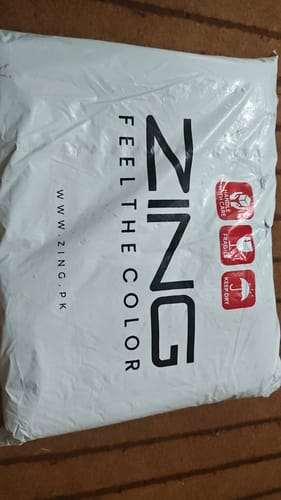 Customer's white shipping bag for The Royal Oud Collection with branding and delivery labels.