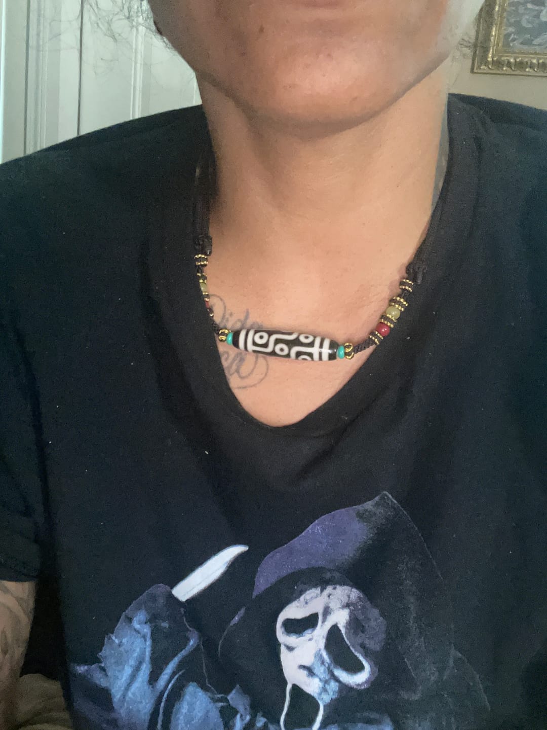 Customer photo review of Nine-Eye Dzi Wish Fulfillment Tibetan Necklace