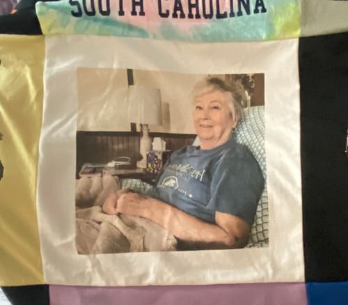 Customer's Project Repat T-Shirt Quilt featuring a custom photo panel of a woman.