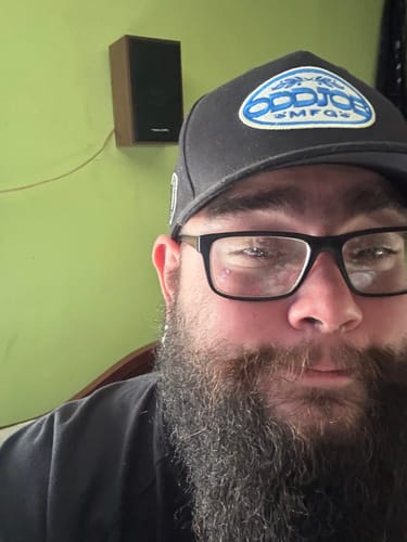 Customer's Big Structured A-Frame Hat worn by a person with a beard and glasses.