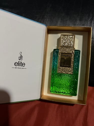 Customer's Perfume Armaf Risala Fragaby 1 bottle inside its open, elegant display box