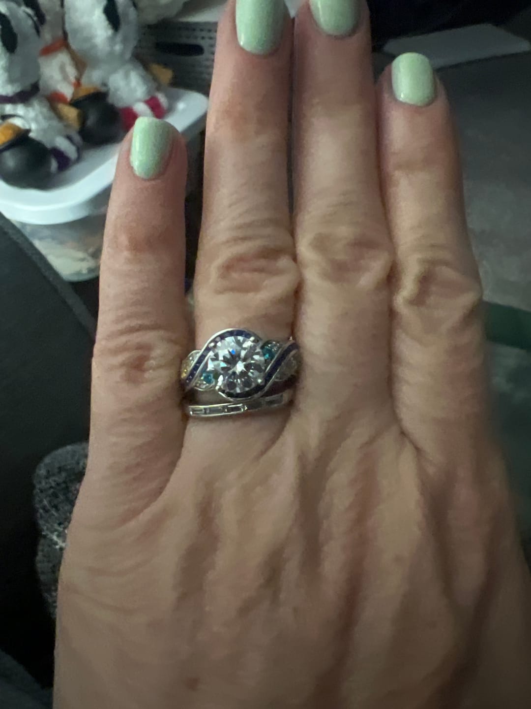 Customer photo review of Starry Night Moissanite Artistic Swirl Accent Engagement Ring