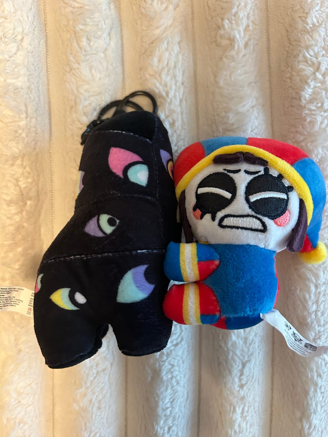 Customer photo review of Pomni & Abstraction Magnetic Plush Keychains