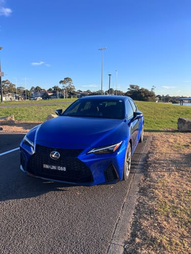Customer's blue Lexus with a front Miniature Plinth installed, parked outdoors.