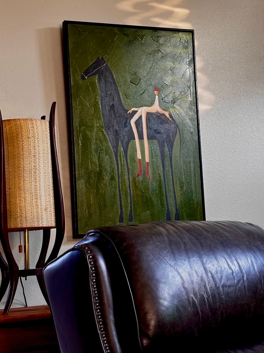 Customer photo review of The Solitary Dreamer – Surrealistic Black Horse & Red Boots Painting | Modern Minimalist Living Room Art