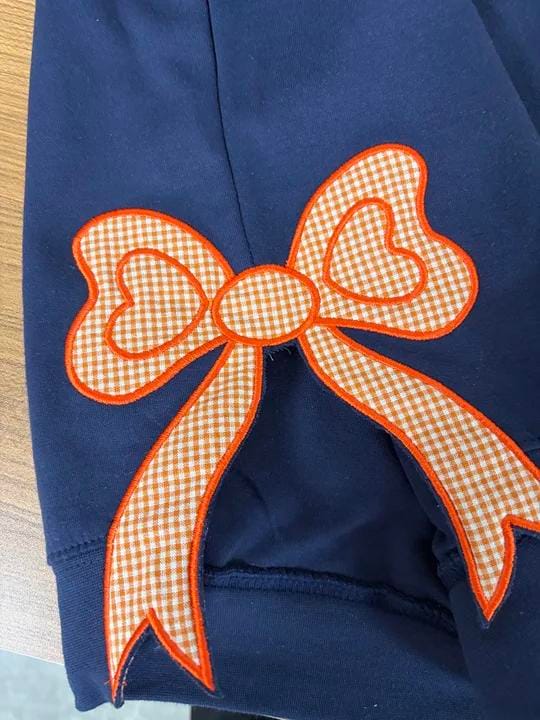 Customer photo review of Custom Tennessee Volunteers Women’s Team Spirit Sweatshirt – Applique Embroidered Side Bow Pullover