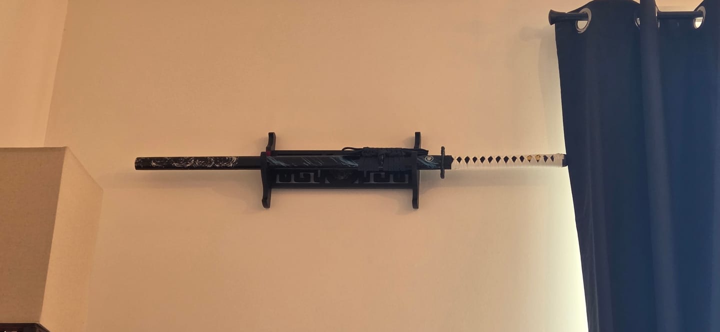 Customer photo review of Demon Slayer - Kyojuro Rengoku Red Nichirin Display (Straight Blade) Katana