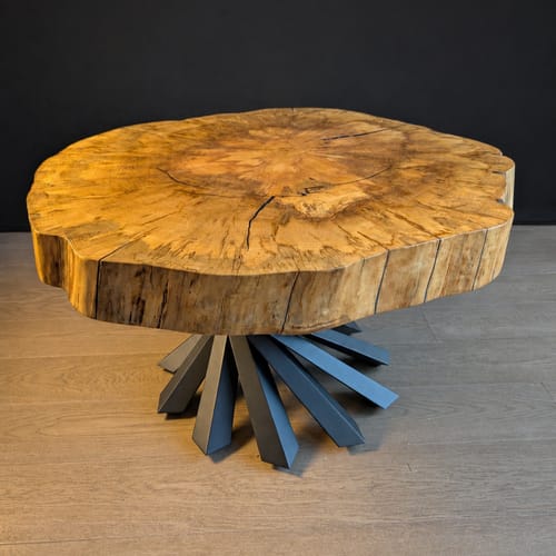 Customer's Black Coffee Table Base 226 Filar attached to a thick, natural wood live-edge slab top.