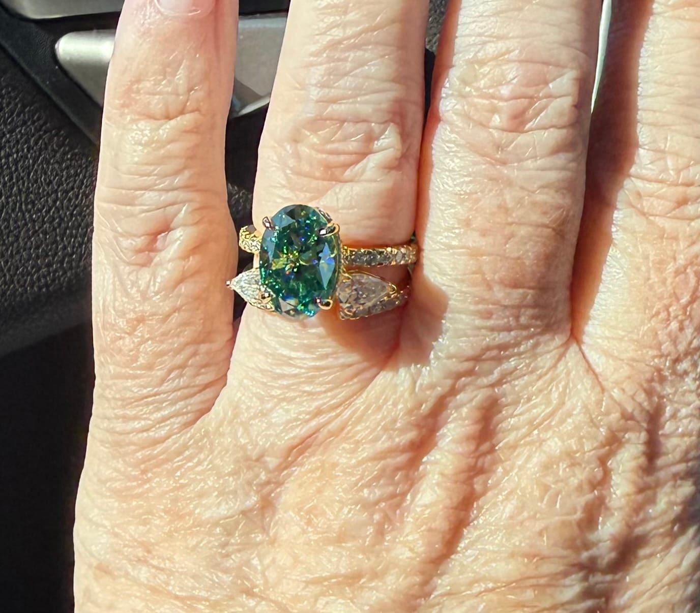 Customer photo review of S925 Moissanite 4.0Ct Oval Cut Yellow Gold Green Stone Wedding Ring with Pear Cut Wedding Band