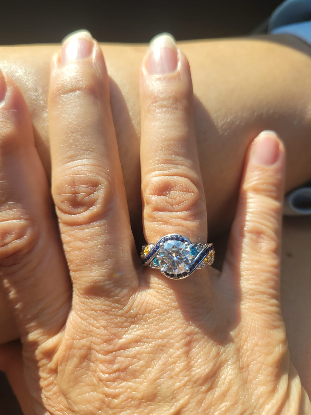 Customer photo review of Starry Night Moissanite Artistic Swirl Accent Engagement Ring