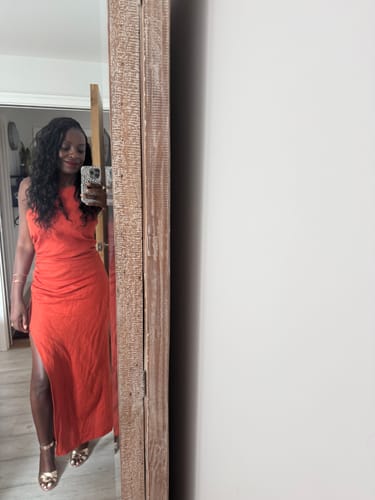 Customer's Miracle Knots crochet hair with soft waves shown on a person in a red dress.