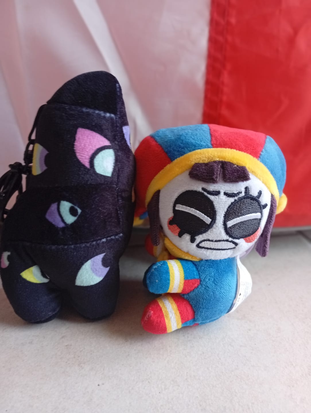Customer photo review of Pomni & Abstraction Magnetic Plush Keychains