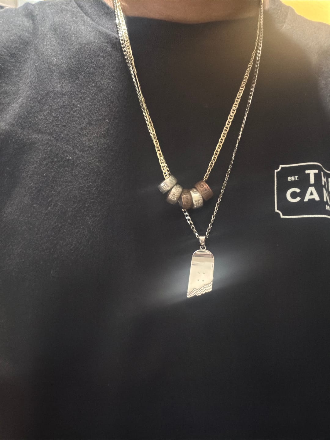 Customer photo review of Broken Skateboard Pendant (Silver)
