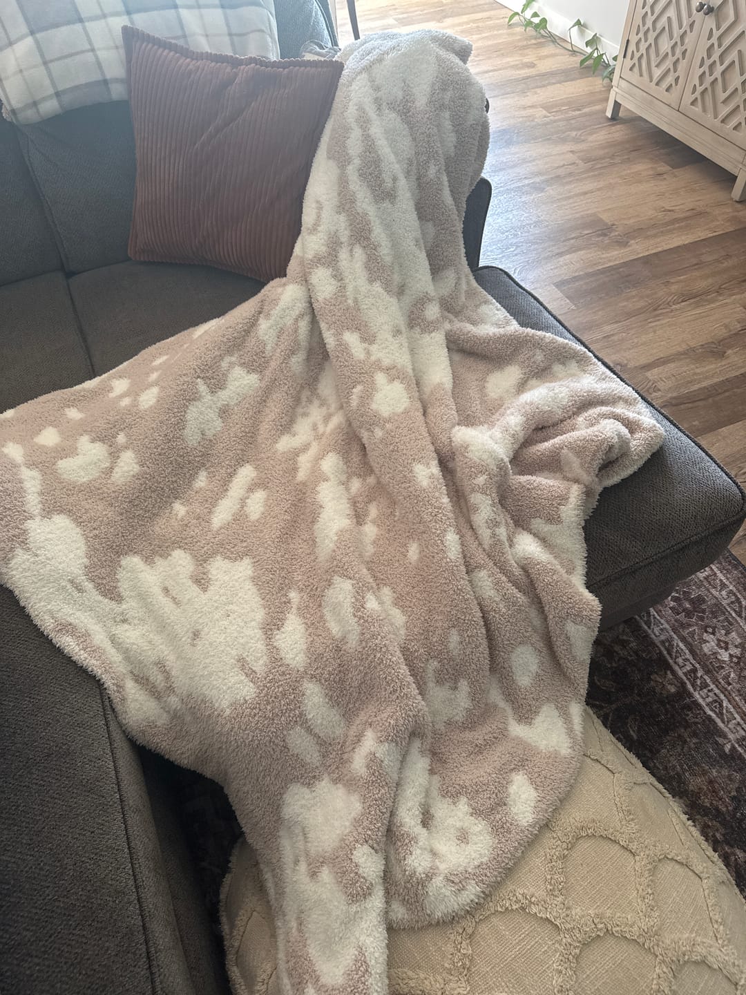 Customer photo review of Blushing Beige & White Cow Print Extended Throw