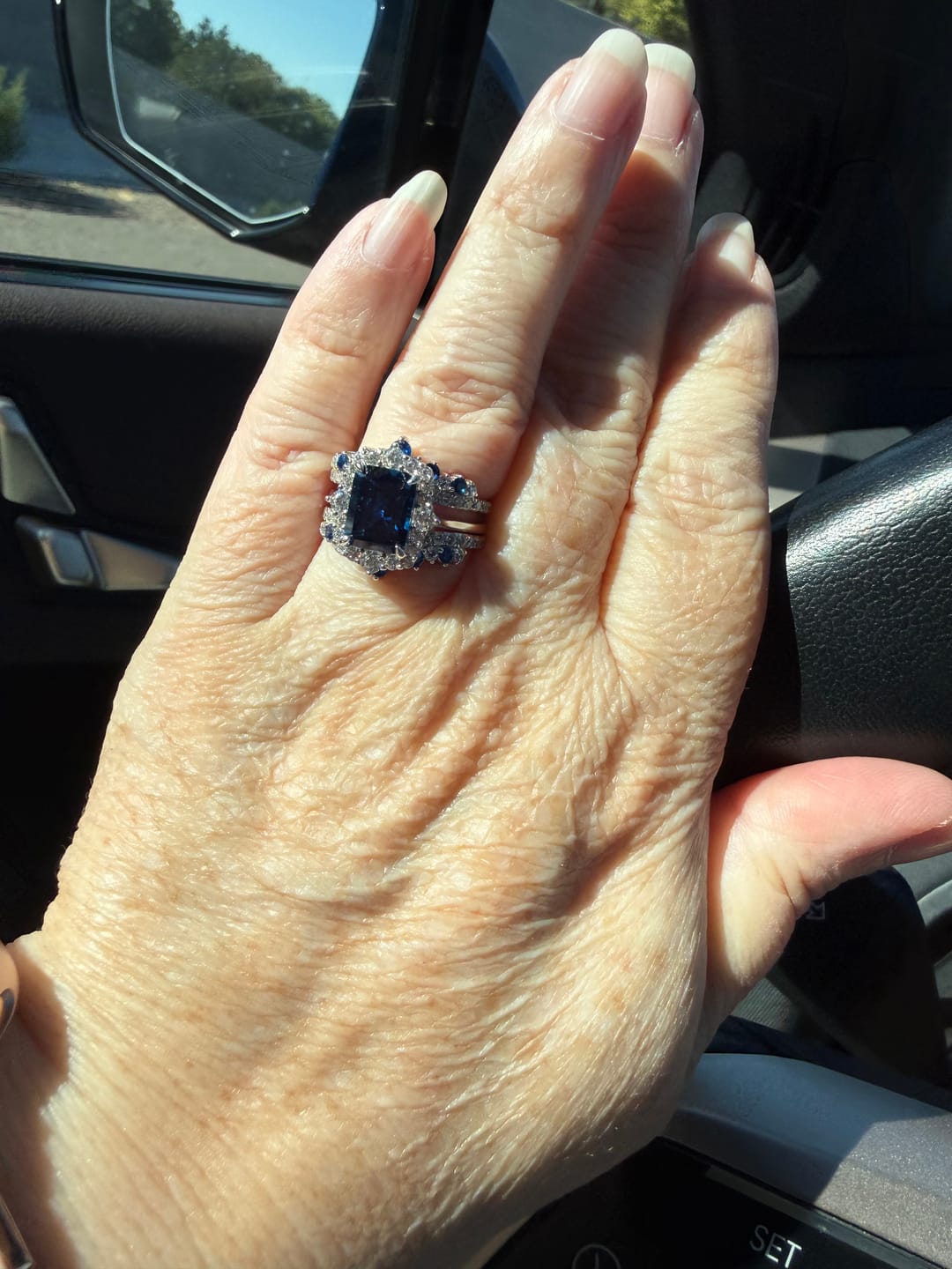 Customer photo review of S925 3.0 Carat Halo Emerald Cut Blue Sapphire Engagement Ring In Sterling Silver