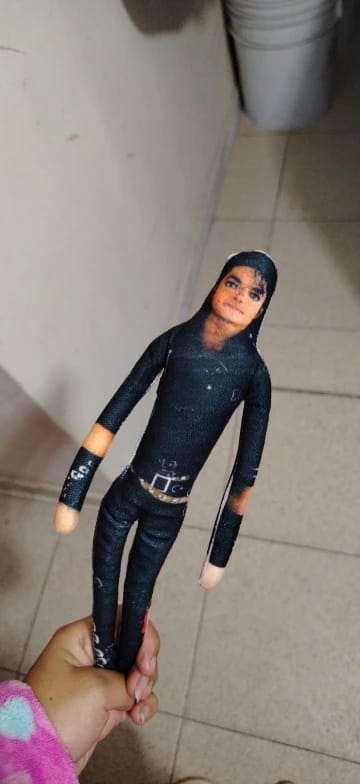 Customer photo review of Mini Michael Doll Plush
