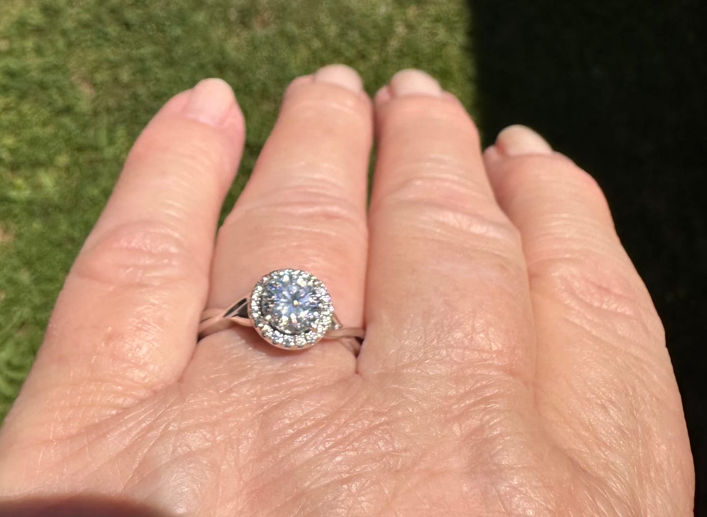 Customer photo review of Halo Moissanite Criss Cross Shank Engagement Ring