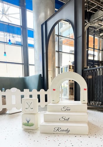 Reviewer's Soft Play 8-Cubes set arranged in a playroom with white foam shapes featuring golf graphics and lettering