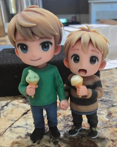 Customer's Personalized Pet 3D Figurine set showing two custom chibi figures holding small ice cream cones.