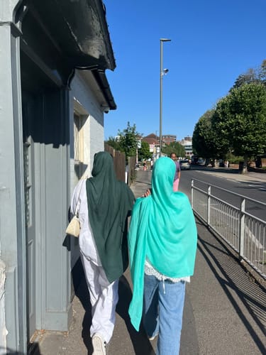 Customer's Turquaz Premium Modal hijab worn in a bright outdoor setting, showing its vibrant turquoise color.