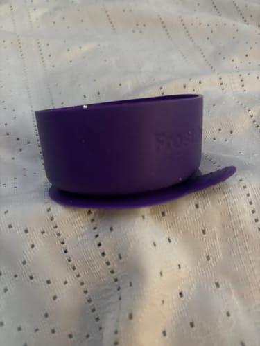 Customer's purple silicone Suction Bumper for a Frost Buddy cup, sitting on a textured white surface.
