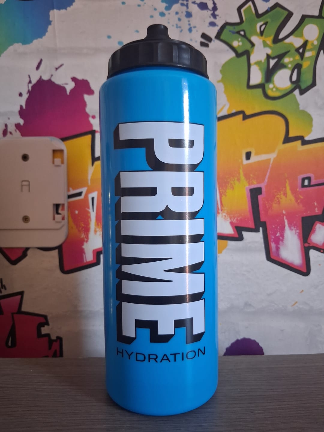 Customer photo review of Official PRIME Hydration Official Blue Squeeze Sport Water Bottle Promotional Item