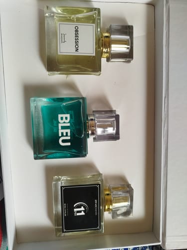 Customer's OUD Supreme Bundle set showing three perfume bottles labeled Obsession, Bleu, and 11 inside a white box