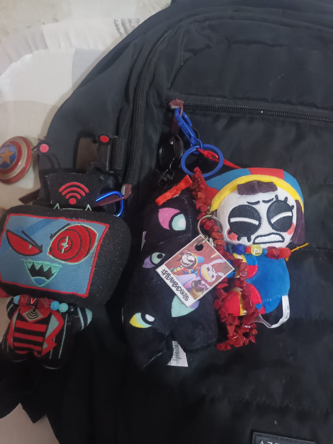 Customer photo review of Pomni & Abstraction Magnetic Plush Keychains
