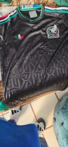 Customer's black Mexico Tercera 2026 soccer jersey with geometric patterns and team emblem.