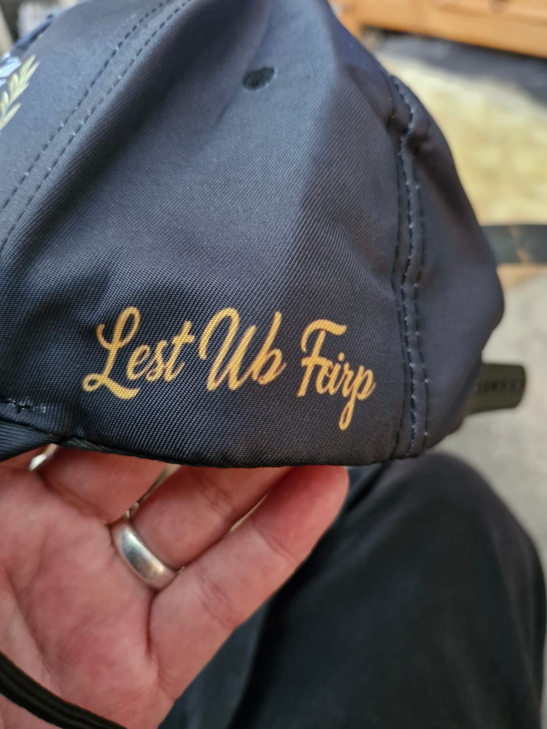 Customer photo review of 🧢"Lest We Forget" Remembrance Flowers Baseball Cap - Meaningful Patriotic Gift for Veterans & Family