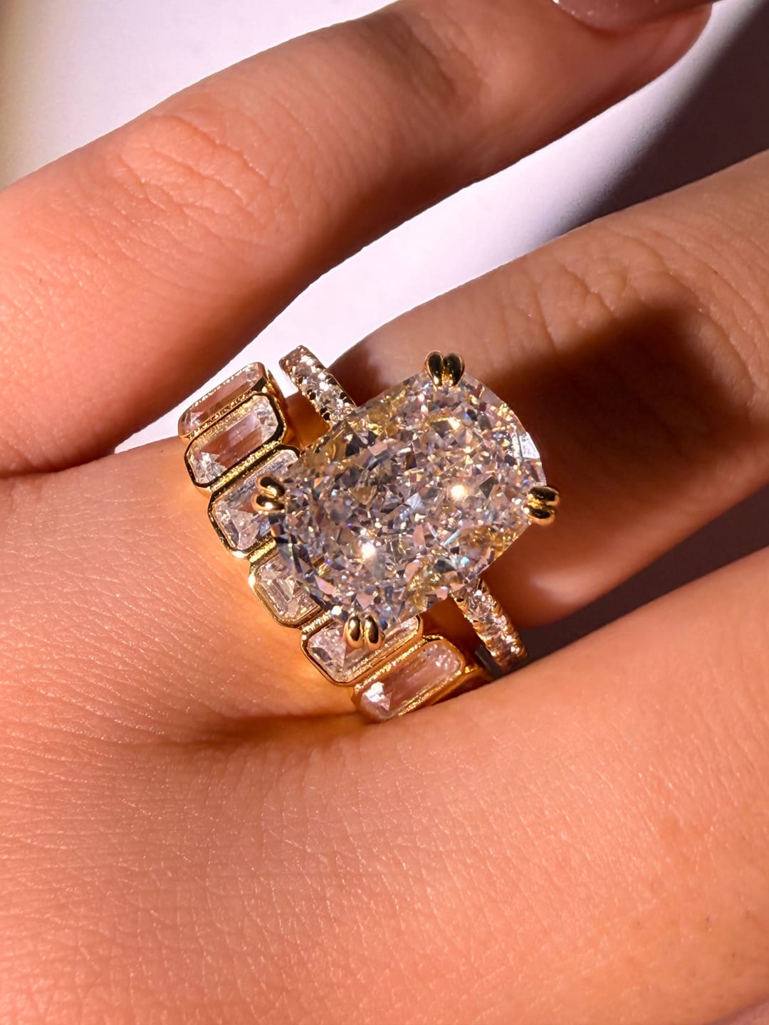 Customer photo review of S925 5.5Ct Cushion Cut Engagement Ring & 2.8Ct Emerald Cut Half Eternity Wedding Band Stackable Ring Set