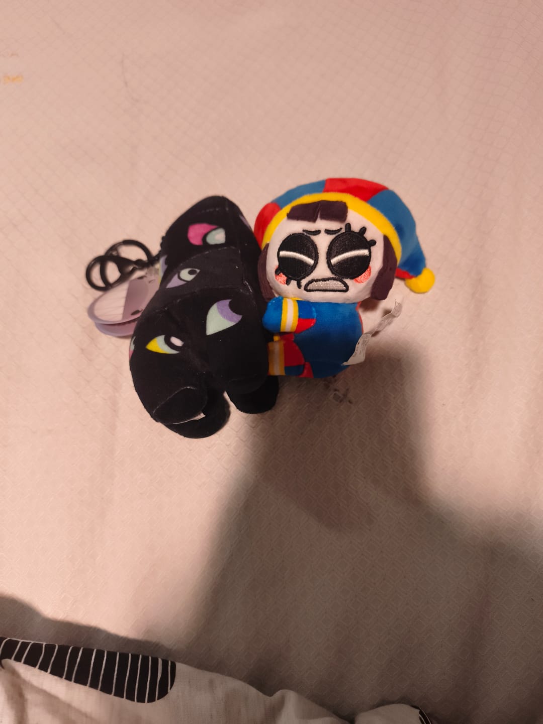 Customer photo review of Pomni & Abstraction Magnetic Plush Keychains