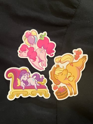 Customer's Seasonal Sticker Sale vinyl stickers featuring colorful pony characters on a dark surface.