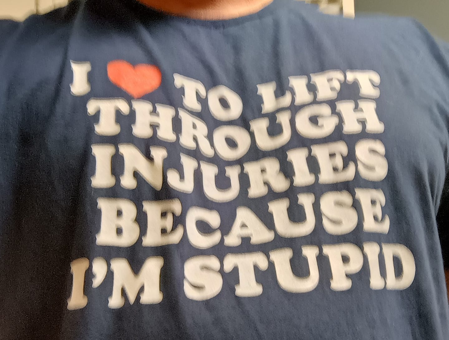Customer photo review of I Love to Lift Through Injuries T-Shirt