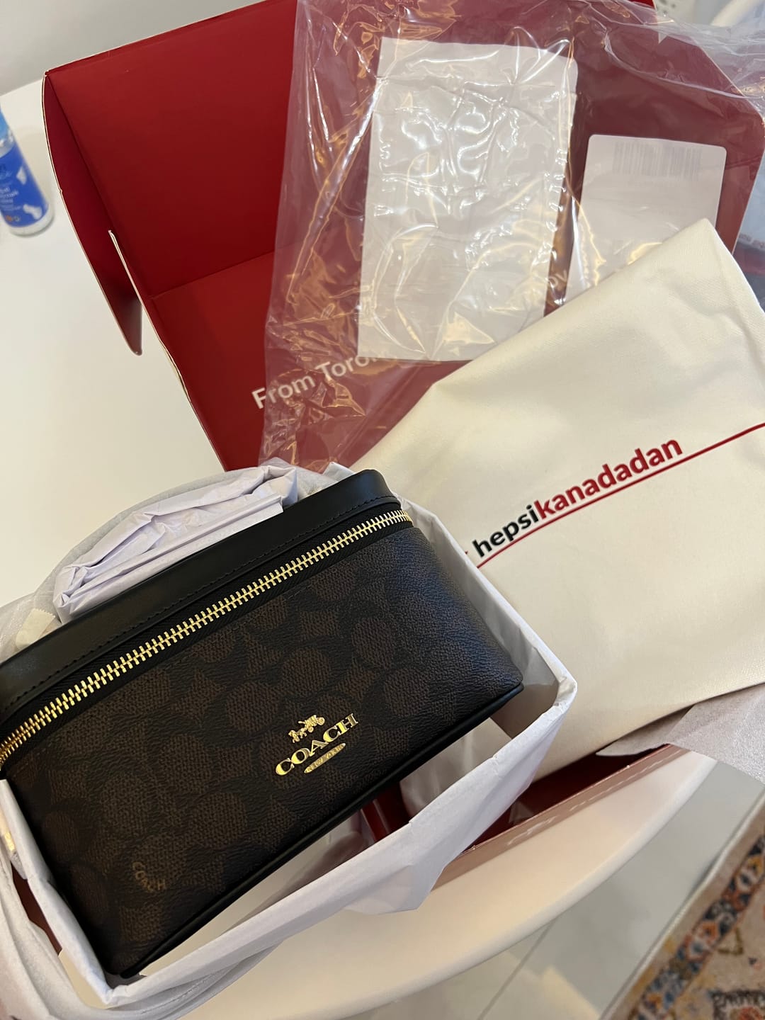 Customer photo review of Coach Women's Rainer Crossbody Bag 18 In Signature Canvas Gold/Walnut/Black