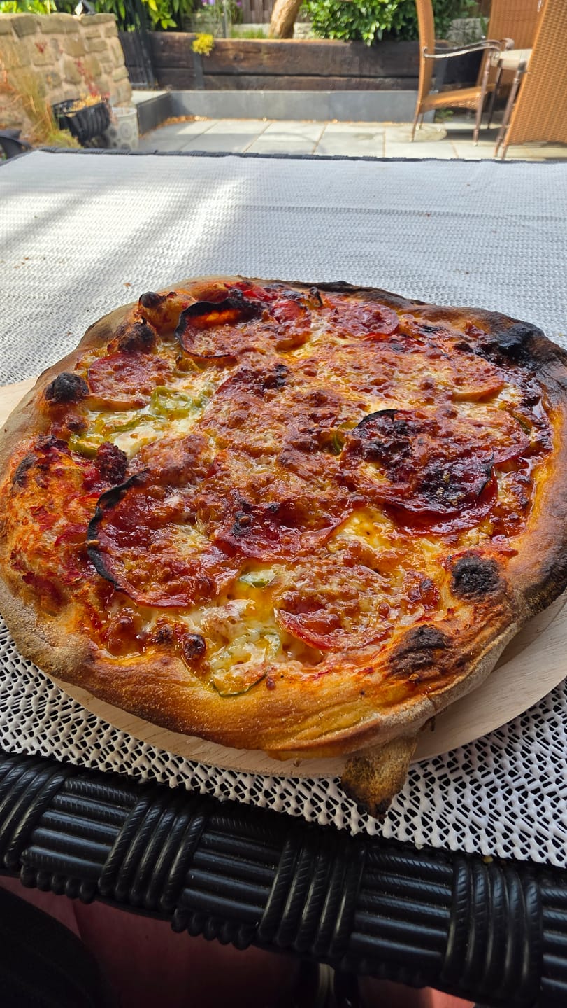 Customer photo review of Topped Spicy Pizza