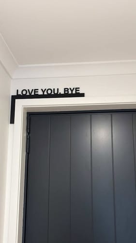 Customer photo review of Love You Bye Door Frame Sign
