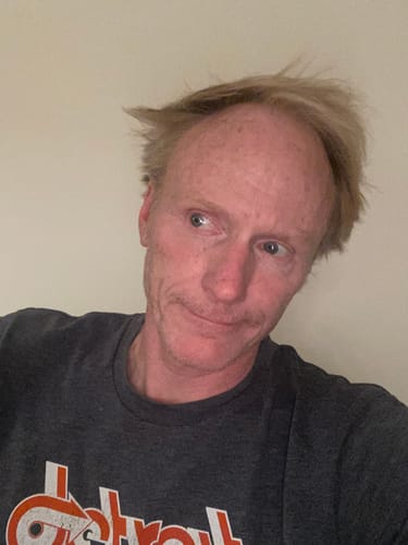 Customer's selfie wearing a dark t-shirt, reflecting on the purchase of the Modal Sport Briefs.