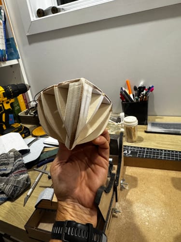Customer's Albatros Color Pack wooden hull skeleton being held in hand.