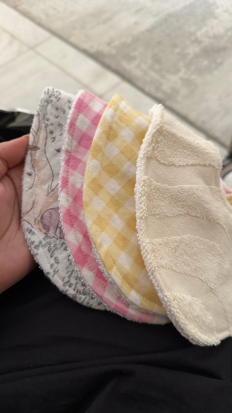 Customer photo review of Blush Pink Gingham Signature Bib