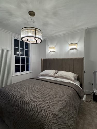 Customer photo review of Alden Tall Headboard Winged Stripe Bed