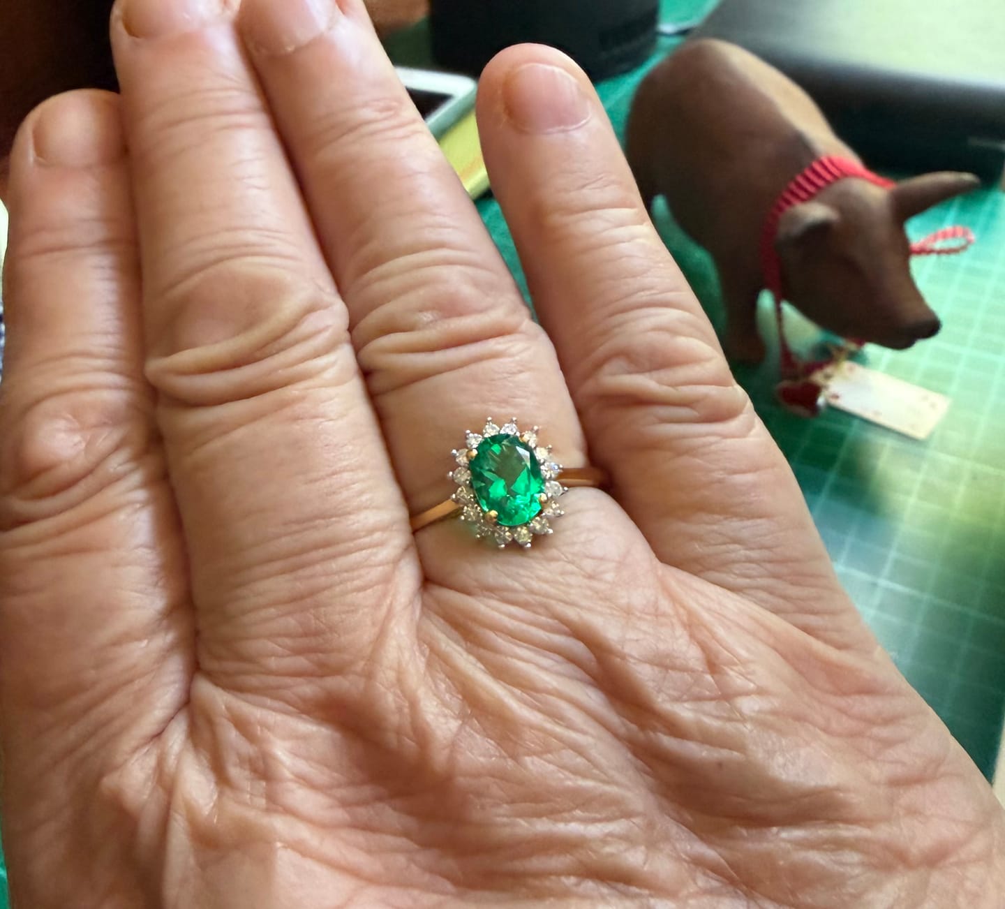Customer photo review of Oval Emerald Diamond Sunburst Halo Ring