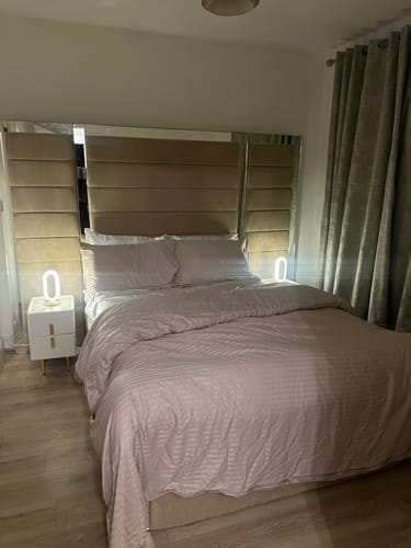 Customer photo review of Buckingham Wide Extended Headboard Mirror Stripe Line Panelled Bed