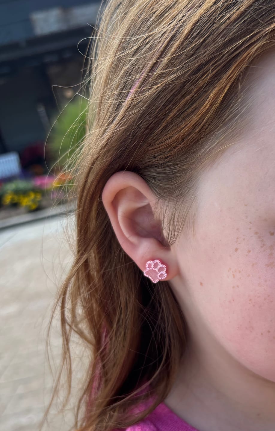 Customer photo review of Paw Print Studs Hypoallergenic Earrings for Sensitive Ears with Plastic Posts