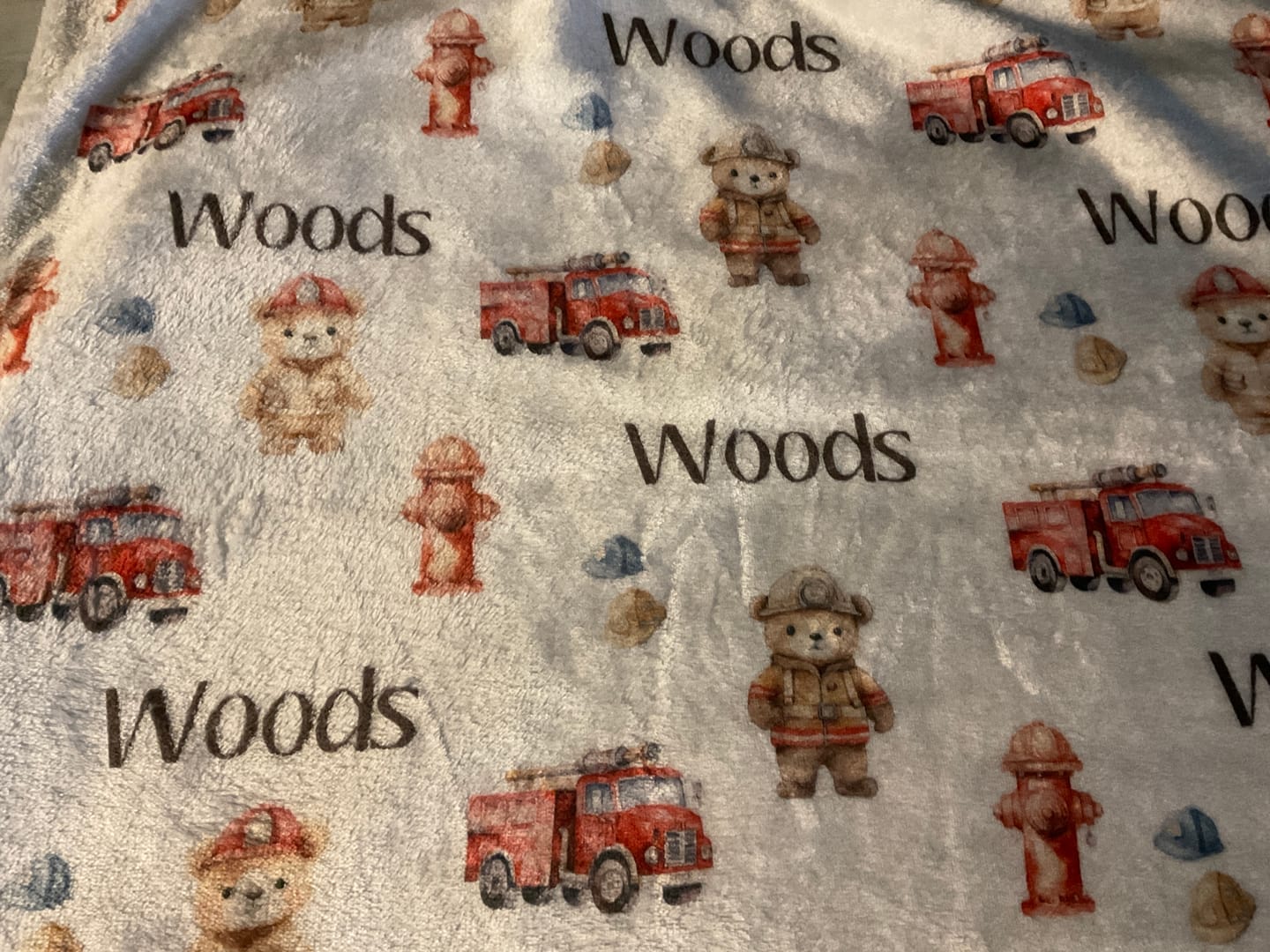 Customer photo review of Fireman and firetruck personalized baby boy blanket